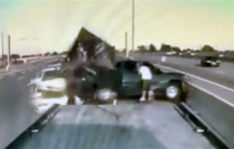 Car Ploughs Into Broken Down Truck Throwing Man Into Oncoming Traffic