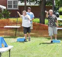 Each player throws three washers toward the opposite cup. How to Play Washers Game - Rules, Distance, Washer Boards DIY