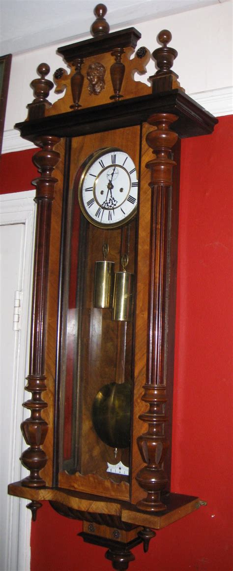 Clock hanging on wall ticking showing twelve hours. Antiques Atlas - Double Weight Vienna Wall Clock
