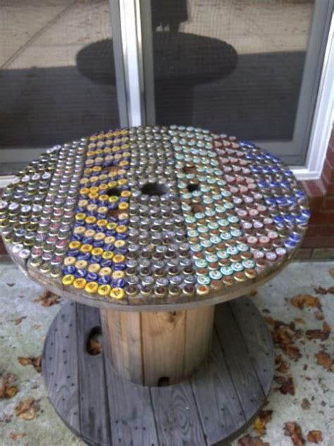 We've been collecting bottle caps for what seems like forever anticipating this table. Pin by Big Raspler on Crafts :) | Spool furniture, Cable ...