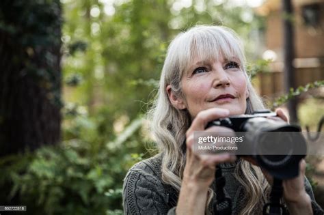 Woman Taking Nature Photographs Outdoors High Res Stock Photo Getty
