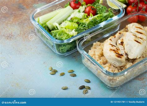 Healthy Meal Prep Containers With Quinoa Chicken Breast And Green Salad Overhead Shot With Copy