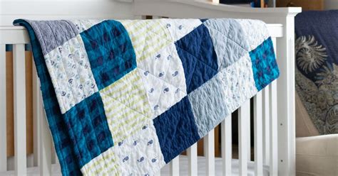 While it's perfectly acceptable to turn your entire collection into a quilt, consider dividing your tees into themes. Simple Upcycled Receiving Blanket Quilt | Scratch and Stitch