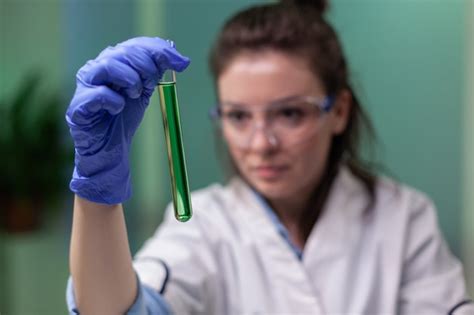 Premium Photo Closeup Of Scientist Woman Looking At Test Tube With