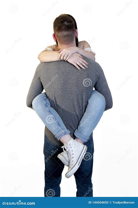 Playful Couple With Young Woman Wrapped Around Boyfriend S Waist