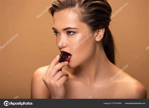 Beautiful Naked Woman Eating Chocolate Piece Isolated Beige Stock Photo