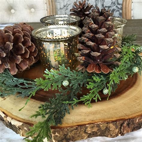 Wood slabs, wedding reception decor, wood centerpieces, tree rounds, . Wood slab centerpiece with mercury glass and pine cones ...