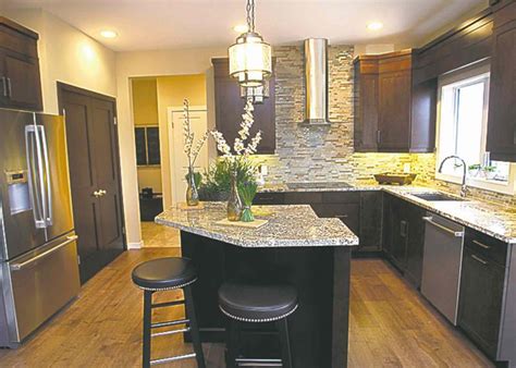 Amazing gallery of interior design and decorating ideas of angled kitchen island in kitchens by elite interior designers. Posh but practical - Winnipeg Free Press Homes