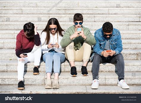 Group Teenagers Sitting On Stairs Concentrated Stock Photo 2157440599
