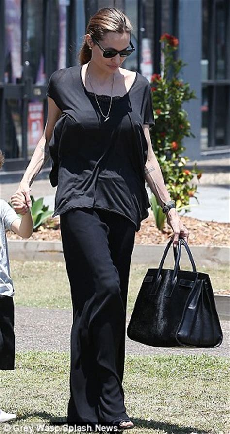 Angelina Jolie Displays Shockingly Veiny Arms While Taking Twins