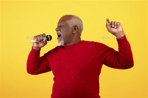 Cool Senior Black Man Singing Song Using Microphone Performing