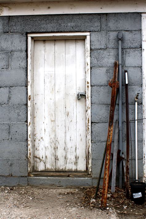 Old Shed Door With Metal Stakes Leaning Next To It Picture Free