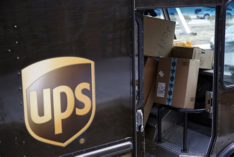 UPS deftly navigates shipping surge, hit by pension charge