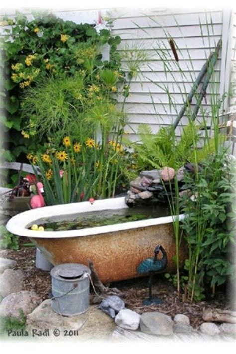 This is an interesting way to reuse an old tub and make a large water feature how to transform an old clawfoot bathtub into a a charming garden pond with aquatic plants. Bathtub fountain | Garden bathtub, Outdoor gardens, Water ...