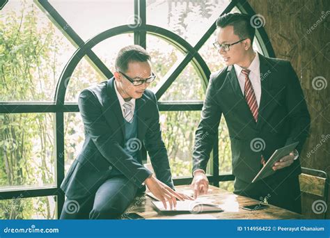 Two Asian Businessman Are Meeting About Business Plan Marketing And