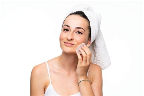 Premium Photo Young Woman Removing Makeup From Her Face With Cotton Pad