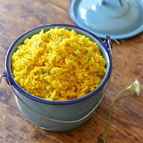 Pour in rice, garlic, salt, turmeric, coriander, cumin, and bay leaves. Easy Yellow Rice | Virtually Homemade: Easy Yellow Rice