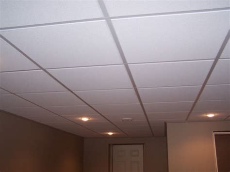 Spread drop cloths all over the floor of the room. How To Install A Suspended Ceiling