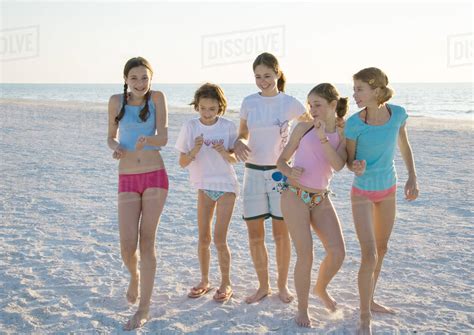 Group Of Girls Dancing On Beach Stock Photo Dissolve