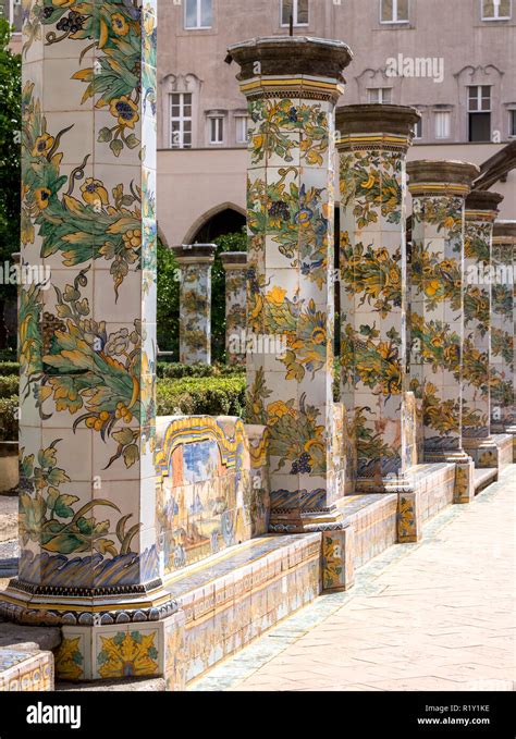 colourful tiled pillars and bench in the cloister garden at the santa chiara monastery in via