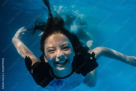 Babe Preteen Girl Having Fun Swimming In A Pool Underwater Stock Photo Adobe Stock
