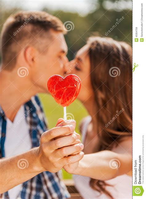 Stealing A Kiss Behind The Lollipop Stock Image Image Of Heart Outstretched 45354759