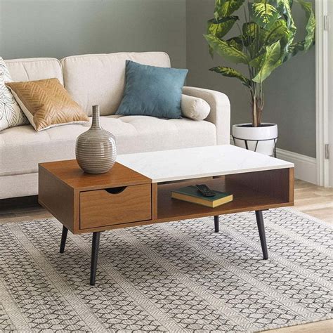 Modern and rustic, with a hint of traditional style, this table meets your storage needs with finesse. The Top 10 Best Mid-century Modern Coffee Tables 2020