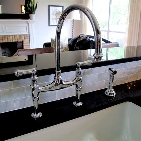 This restoration kitchen bridge faucet with brass sprayer will draw lots of attention from guests and visitors. Sunday Loft: Rohl Bridge Faucet