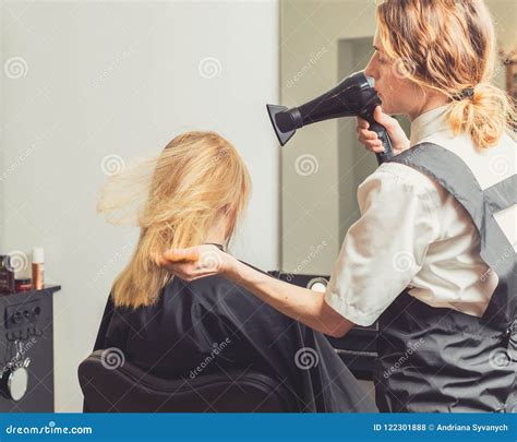 Beautician Blow Dry Woman S Hair At Beauty Salon Stock Photo Image Of