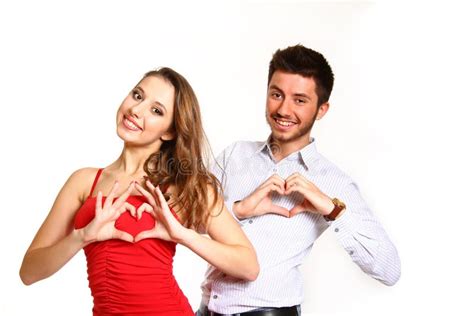 Beautiful Girl And Boy Forming Heart With Her Hands Isolated On Stock
