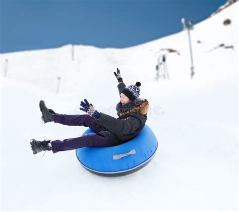 Happy Boy Sliding On Sled Down Snow Hill In Winter Stock Photo Image