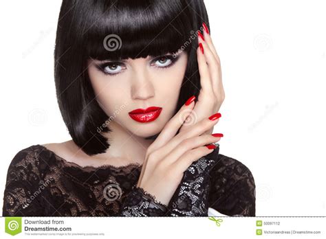 trucco chiodi manicured ritratto della ragazza di bellezza orli rossi sh posteriore fotografia