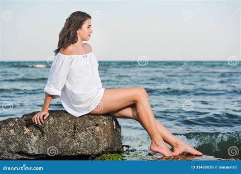 Teen Girl Bikini Slender Pre Teen Girl Smiles And Squats Barefoot In