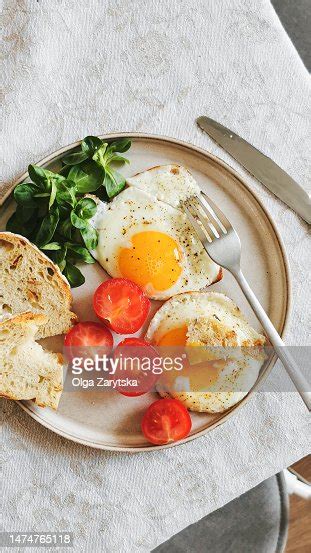 Breakfast With Fried Eggs Tomatoes Salad And Bread High Res Stock Photo