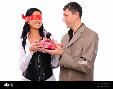 The Young Man Gives His Girlfriend A T The Girls Red Blindfold
