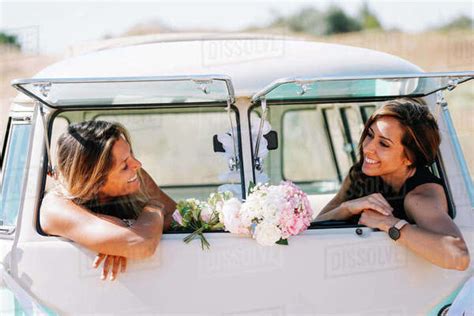 Two Lesbian Women Have Fun In A Vintage Classic Van Stock Photo Dissolve