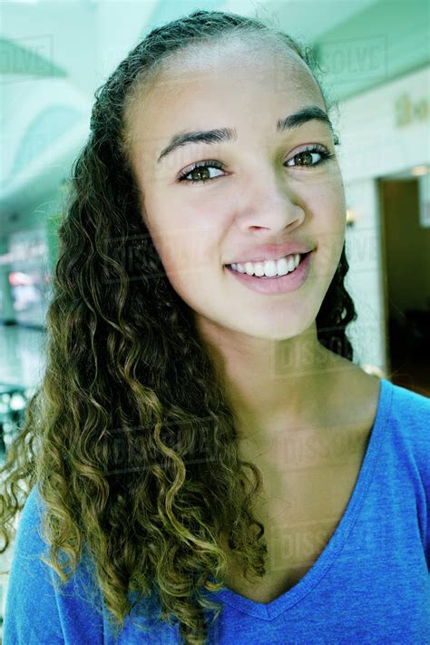 Close Up Of Mixed Race Teenage Girl Smiling Stock Photo Dissolve