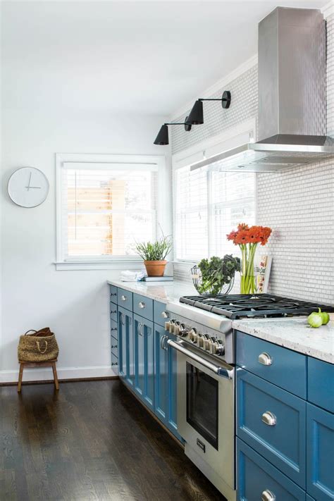 See more ideas about terracotta, top kitchen table, tile top tables. Modern White and Blue Kitchen with Metal Vent Hood, Tile ...