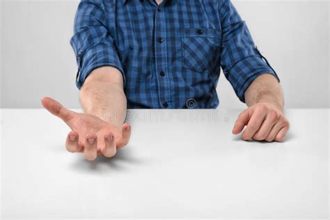 Close Up Hands Of Man Holding Something In His Palm Stock Image