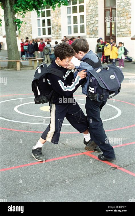 Boys Fighting On School Playground Stock Photo Alamy