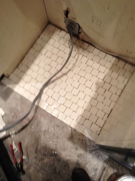 Have you screwed in the adjustable 'feet' of the machine? Ask Me Studio: Laying Tile Under Appliances