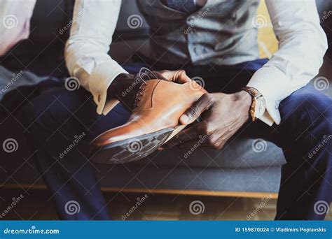 Elegant Man Is Putting On His Shoes Stock Photo Image Of Fashion