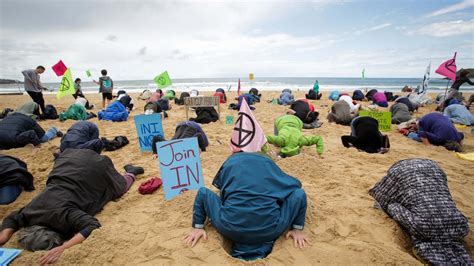 Extinction Rebellion Head In The Sand Protest At Manly Beach News