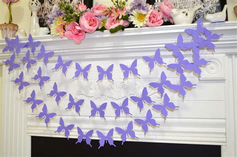 Our butterfly baby shower theme is a favorite for good reason! Butterfly Garland, lavender purple butterflies baby shower ...