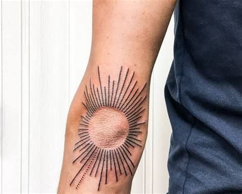 Sunburst Tattoo Meaning Placement And Design Ideas Tattoo Twist