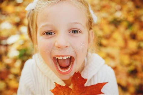 Happy Little Girl Playing With Autumn Leaves Ute Funny Girl With Open
