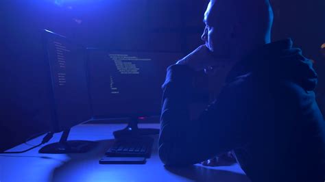 Cybercrime Hacking And Technology Crime Male Hackers In Dark Room With Code On Computer