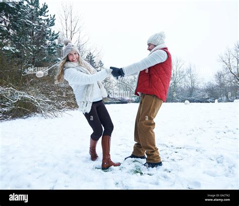 Happy Couple Dancing Together In Winter Snow Landscape Stock Photo Alamy