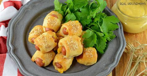 There's just something about piggies in a blanket that bring out the kid in me. Cheesy Pigs in a Blanket ⋆ Real Housemoms