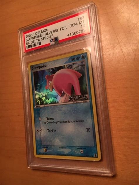 A Pokemon Trading Card On A Wooden Table